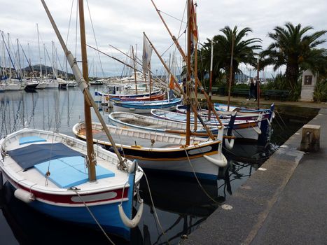 Small boats at Sanary-sur-mer port by cloudy weather, south of France
