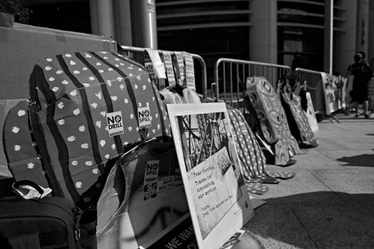 Protester signs at the Rainforest Coalitions protest at the annual Chevron board meeting.