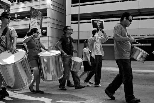 Protesters playing drums at the Rainforest Coalitions protest at the annual Chevron board meeting.