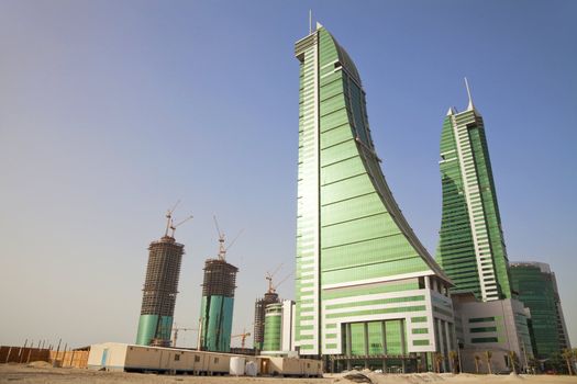 Image of the Financial Harbour towers in the desert, Manama, Bahrain.