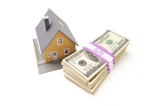 Home and Stacks of Money Isolated on a White Background