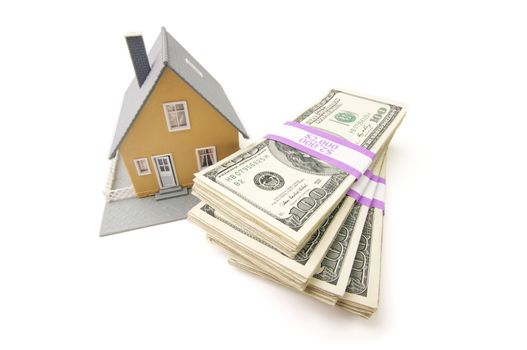 Home and Stacks of Money Isolated on a White Background