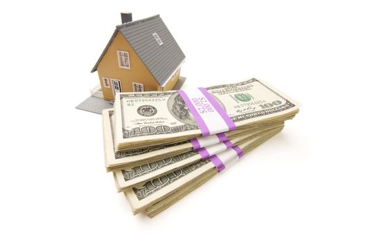 Home and Stacks of Money Isolated on a White Background