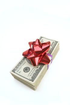 Stack of Money with Bow Isolated on a White Background.