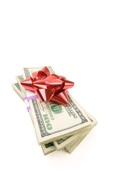 Stack of Money with Bow Isolated on a White Background.