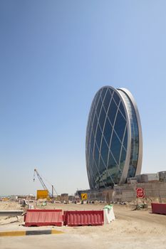 Image of a unique saucer shaped building under construction at Abu Dhabi, United Arab Emirates. One of the many beautiful buildings being constructed in this fast growing country.