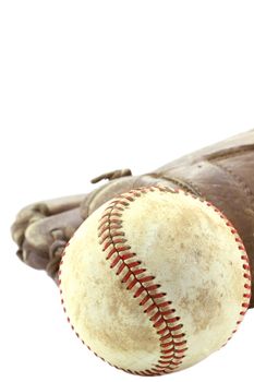 Used baseball and mitt isolated on white with clipping path included. Extreme shallow DOF with selective focus on center of ball.