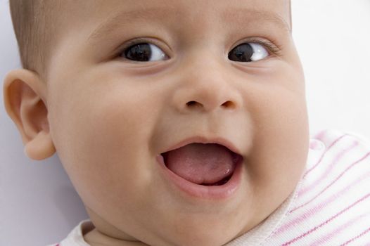 close up of cute baby with white background