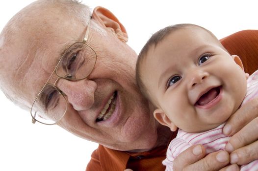 old man holding the cute baby against white background
