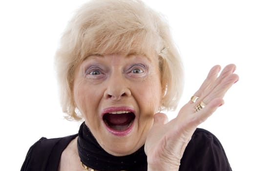 portrait of old woman looking at camera against white background