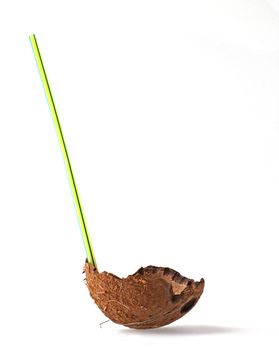 Half coconut with straw over white background