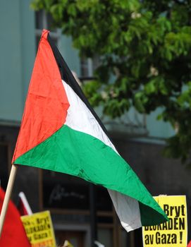Palestinian flag and posters against blakade of Gaza