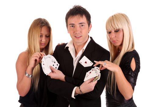 Magician make performance cards with two beauty girls