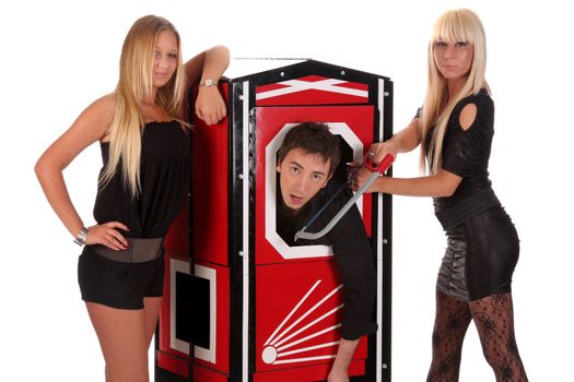 Magician performance and two beauty girls in a magic box with handsaw