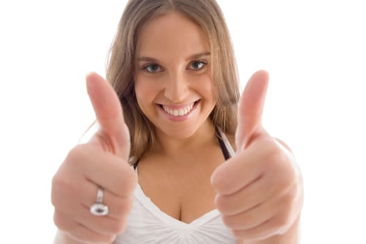 portrait of female with thumbs up on an isolated white background