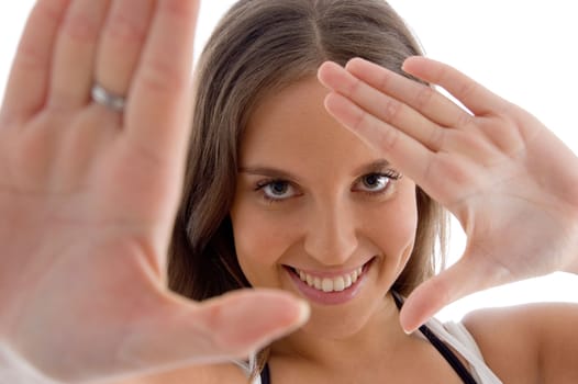 cheerful model showing her palms with white background