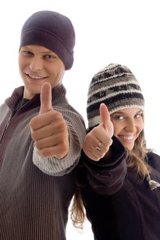 young couple showing thumbs up with white background