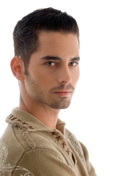 handsome young guy posing and looking at camera against white background