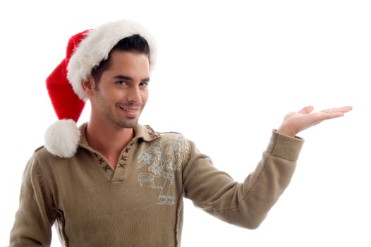 young male wearing christmas hat and holding something with hand gesture against white background