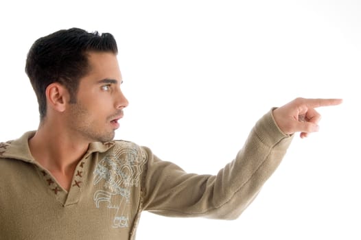 fashionable man pointing sideways with white background