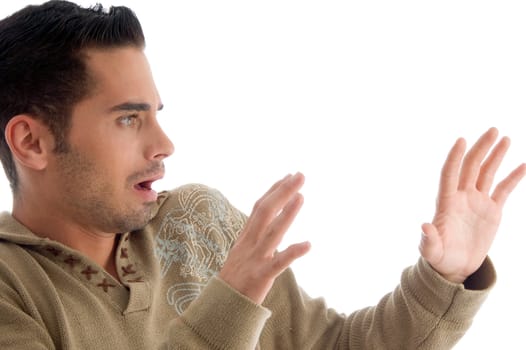 young guy surprised with facial expressions on an isolated background