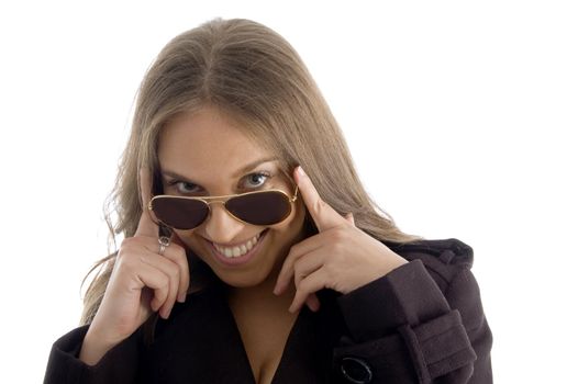 fashion woman peeping over sunglasses on an isolated background