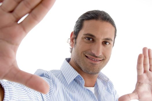 young man making frame with hand gesture on an isolated background