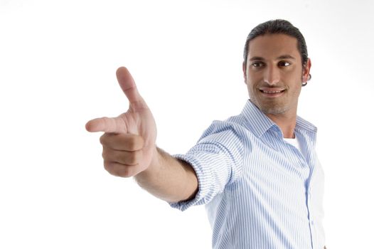 young handsome guy pointing on an isolated white background