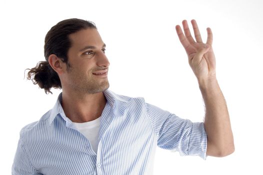 young good looking man with counting fingers against white background