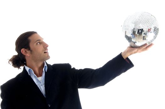 young handsome businessman holding disco ball on an isolated white background