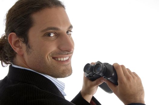cheerful handsome lawyer holding a pair of binoculars on an isolated background