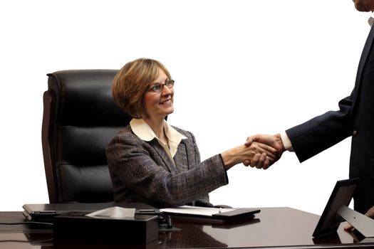 A business woman closing a deal in her office