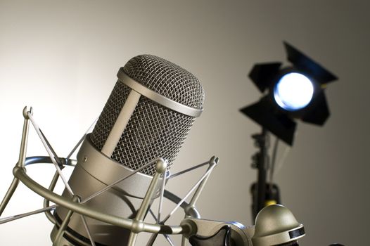Microphone in studio on a light background.