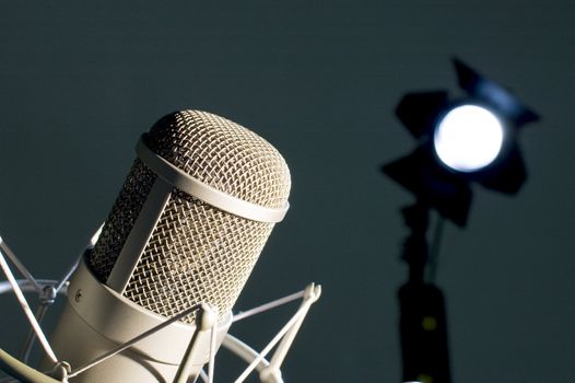 Microphone in studio on a dark background.