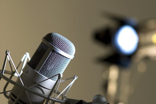 Microphone in studio. Dark blue light.