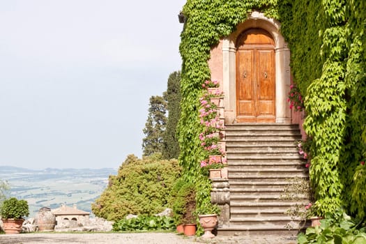 A wooden door and stone steps of a house 
