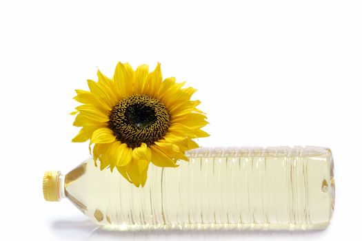 Sunflower with cooking oil bottle on white background