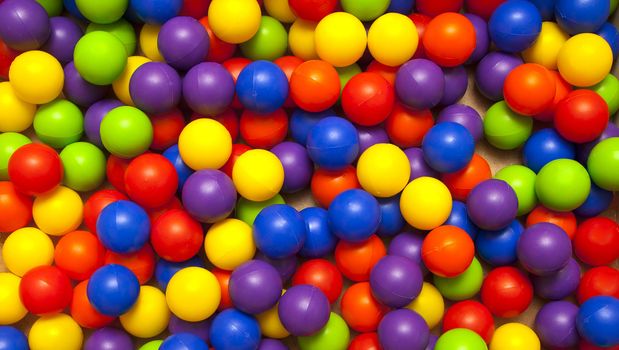 background, colorful plastic balls on children's playground 