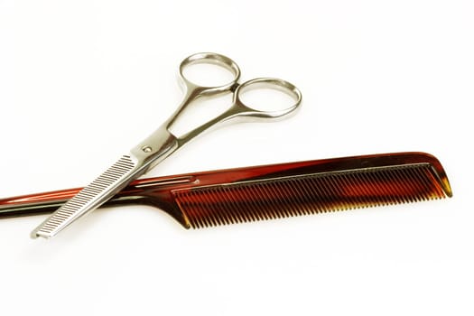 Haircutting tools on bright background