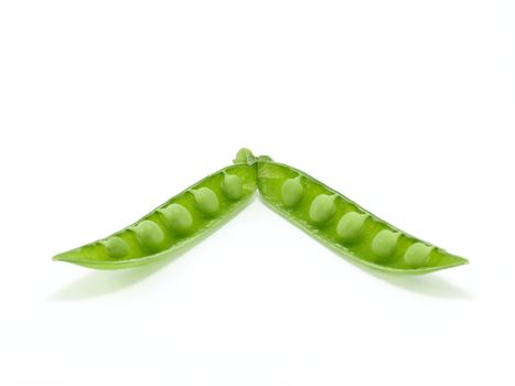 background of open green pea fruit showing seeds