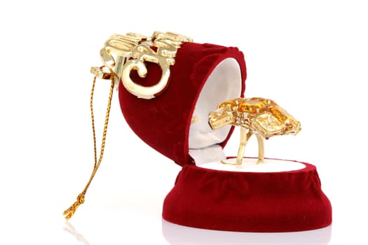 christmas jewelry box open with gold ring isolated on white background
