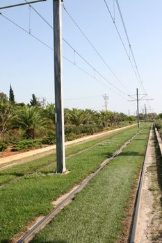 nature and transportation electric railway with grass and plants environmental friendly