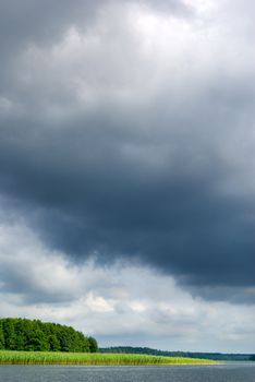 Stormy clouds over the lake. Mazury, Poland.