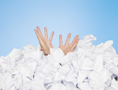Human buried in white papers on blue background