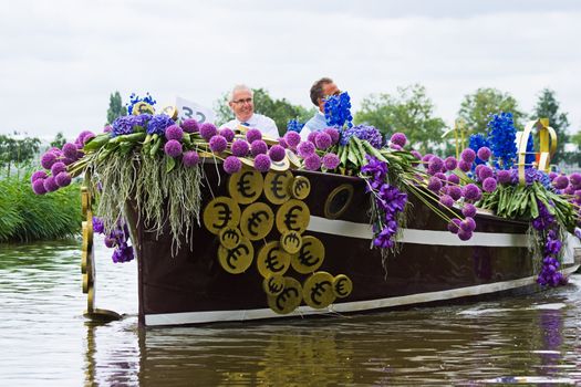 WESTLAND,THE NETHERLANDS - AUGUST 2009: Fabulous decorated boats in the spectacular annual Westland Floating Flower Parade August 02, 2010, Maasland, the Netherlands. 
