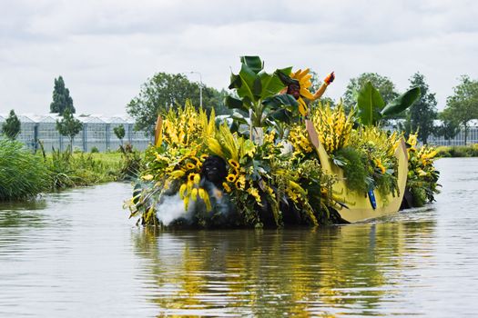 WESTLAND,THE NETHERLANDS - AUGUST 2009: Fabulous decorated boats in the spectacular annual Westland Floating Flower Parade August 02, 2010, Maasland, the Netherlands. 
