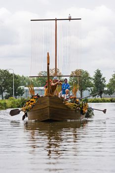 WESTLAND,THE NETHERLANDS - AUGUST 2009: Fabulous decorated boats in the spectacular annual Westland Floating Flower Parade August 02, 2010, Maasland, the Netherlands. 
