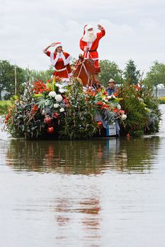 WESTLAND,THE NETHERLANDS - AUGUST 2009: Fabulous decorated boats in the spectacular annual Westland Floating Flower Parade August 02, 2010, Maasland, the Netherlands. 
