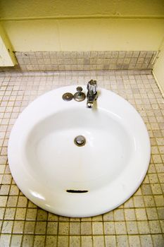 Sink detail in a publich washroom.