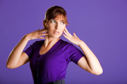 Portrait of a beautiful fashion woman over a violet background